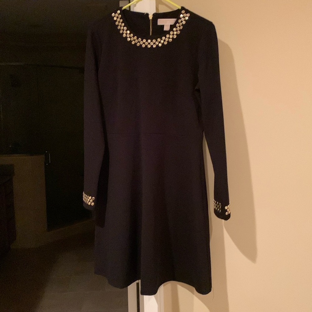 Beautiful Michael Kors black dress with gold studs around the neck and cuffs.